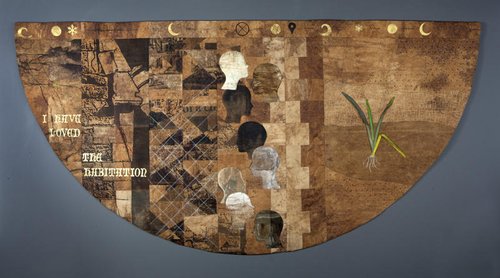 Semi-circular quilt made from cotton, silk and bandage material to commemorate the 22 February 2011 earthquake. The quilt references Christchurch landscape features, buildings and soil profiles and displays 185 sewn crosses, eight facial profiles and a Harakeke