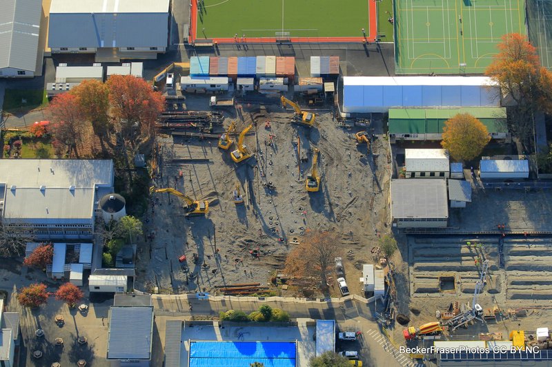 An aerial photo of St Margaret's College. There are five diggers visible working on a large gravel construction site.