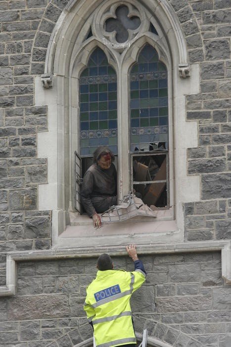 Spigel's rescue from cathedral window by police officer on ladder