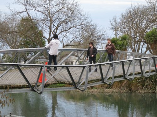 Children walking across the twisted Medway Street bridge